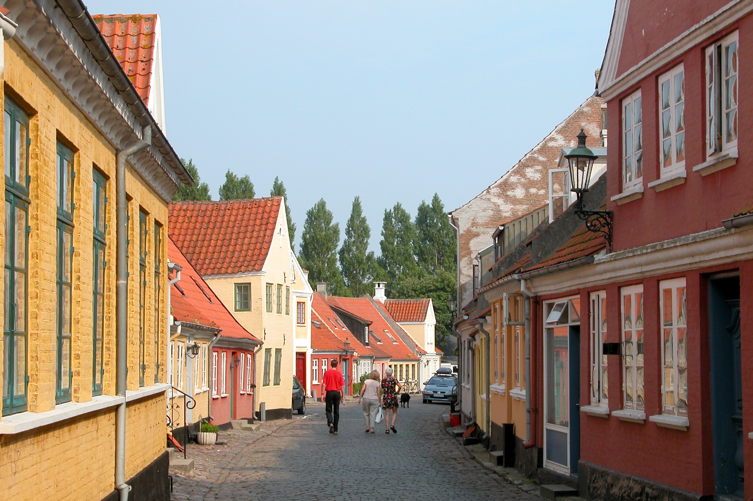 Colourful historic townhouses line the cobblestone Søndergade in Ærøskøbing on the Danish island of Ærø