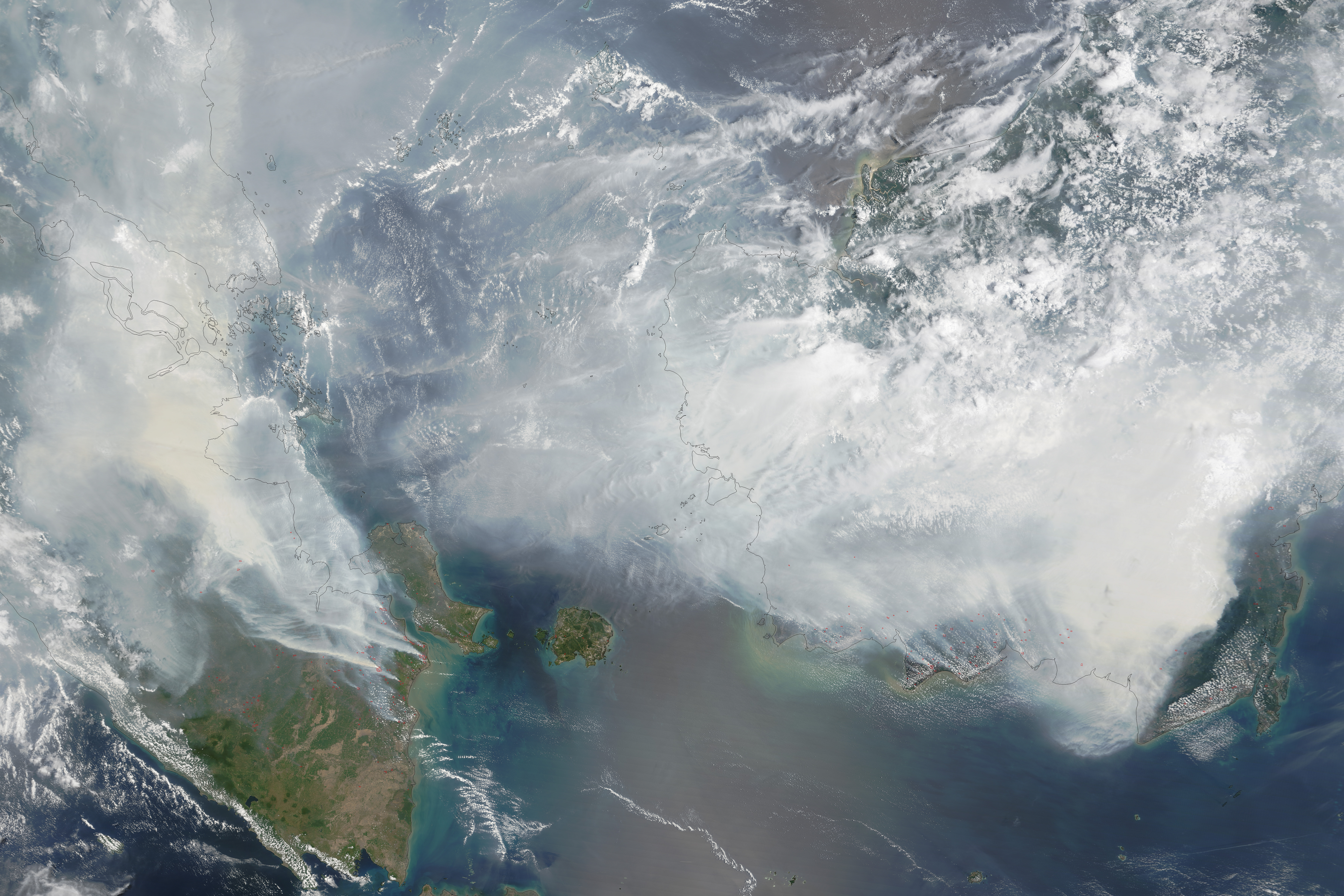 NASA MODIS satellite observation of smoke blanketing Sumatra and Borneo on 24 September 2015