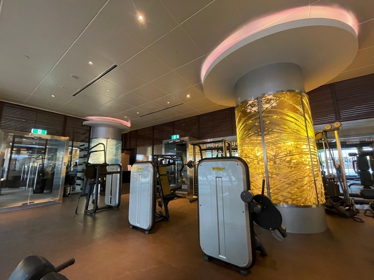 Exercise and fitness area inside a hotel gym.