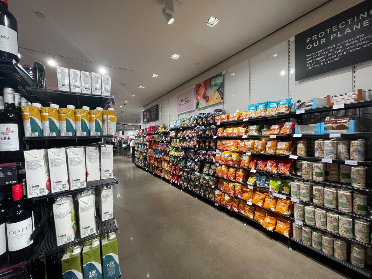 Snacks and juices displayed inside a Marks & Spencer store in Singapore.