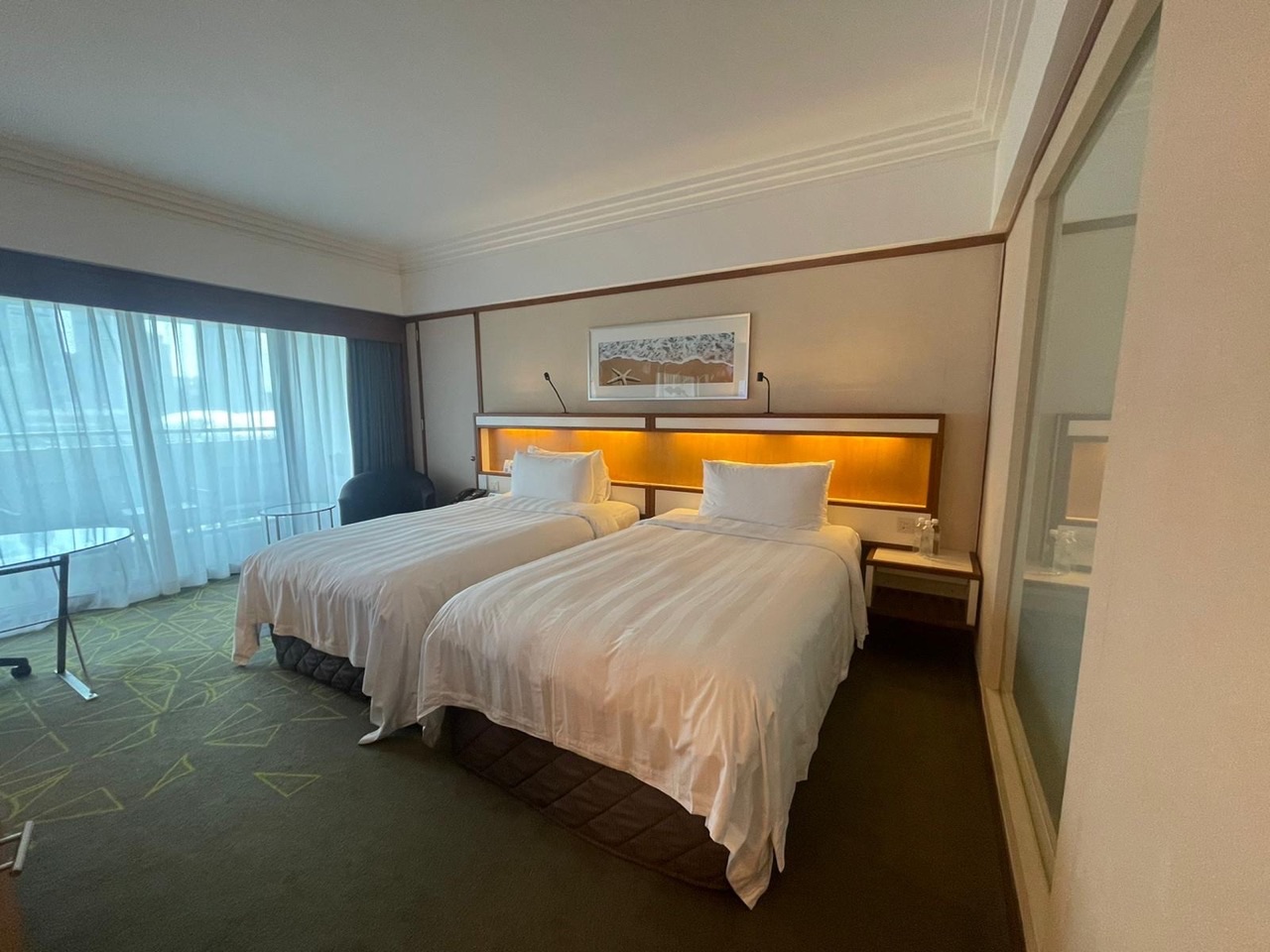 Hotel room with two separate beds at Pan Pacific Singapore.