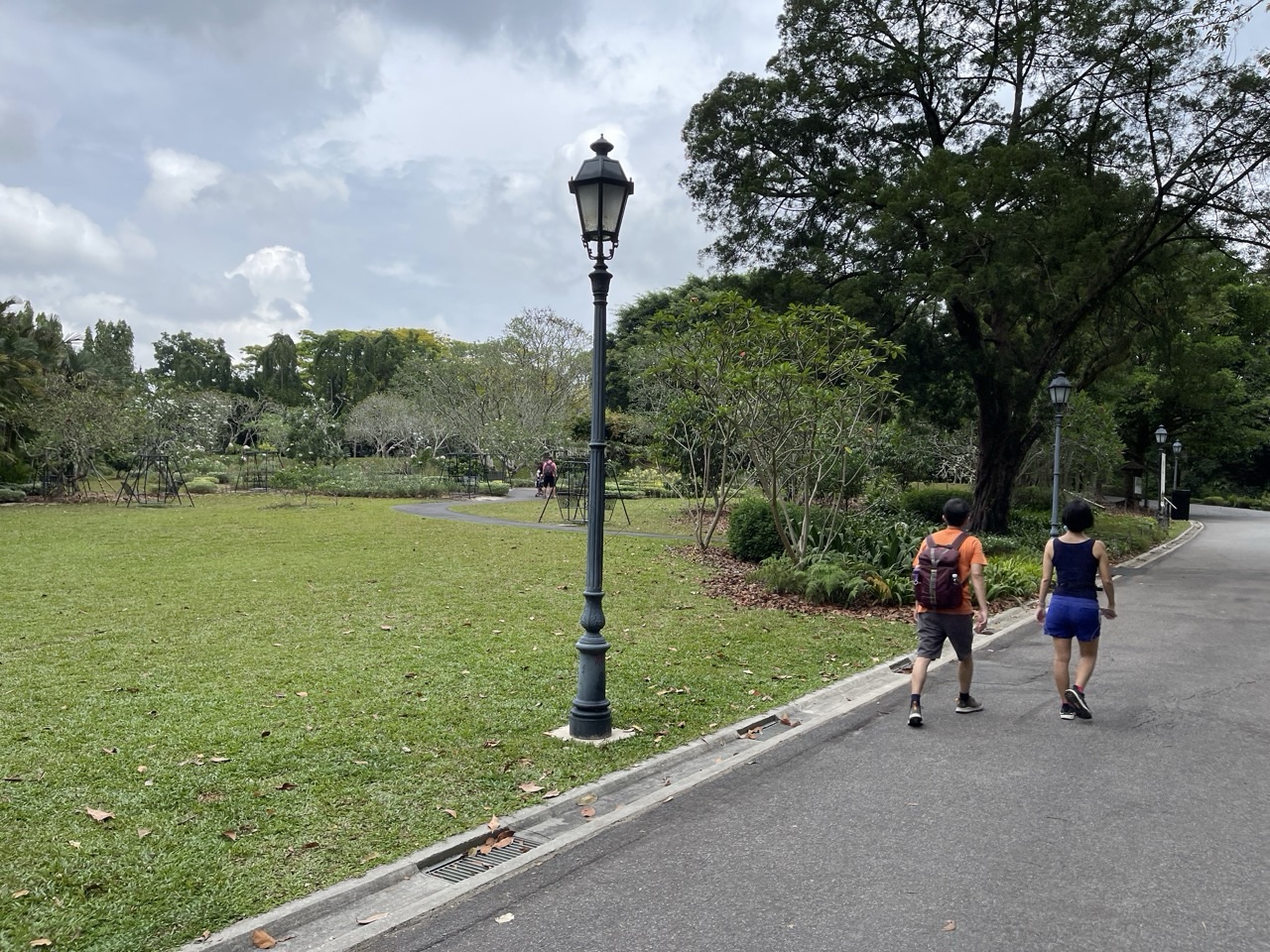 Couple exercising together in Singapore Botanic Gardens.