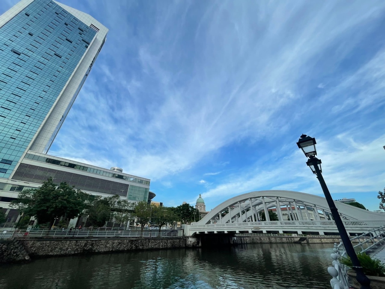 Singapore River and Civic District beneath blue skies.