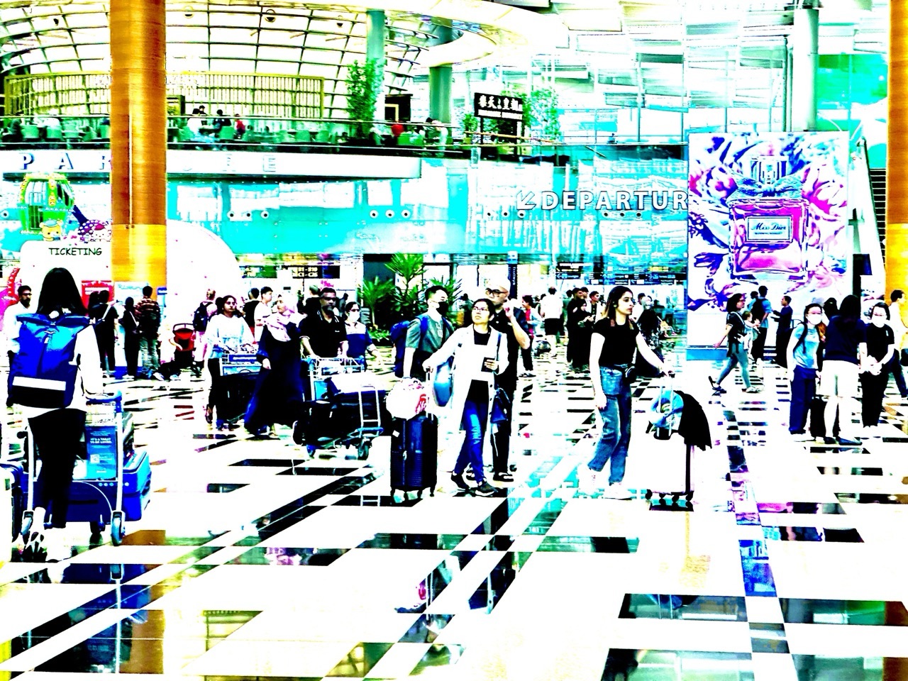 Travellers with baggage in the departure area of Changi Airport Terminal 3.