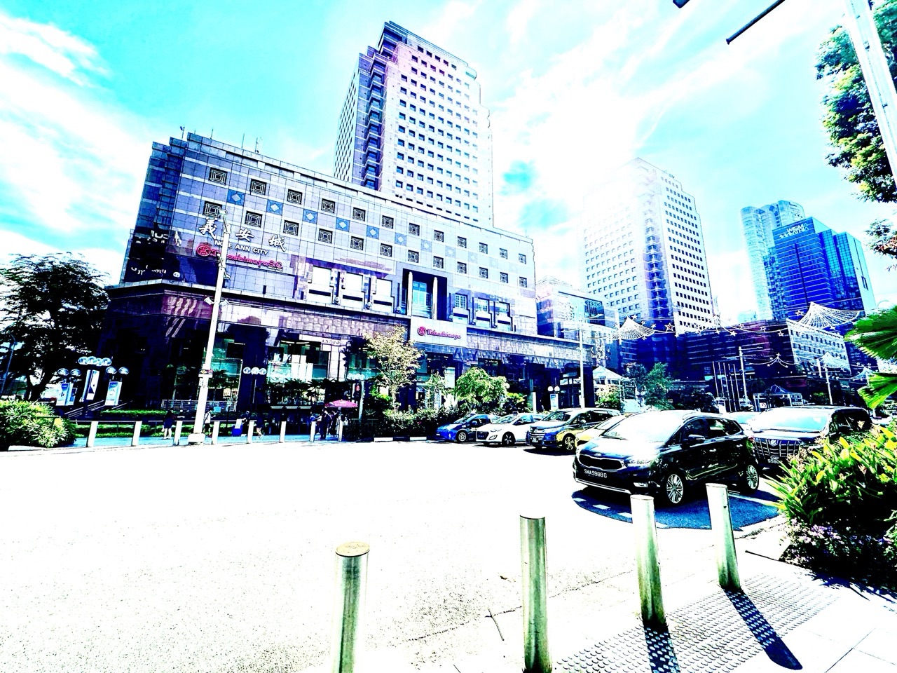 Pedestrian crossing outside Ngee Ann City on Orchard Road in Singapore.