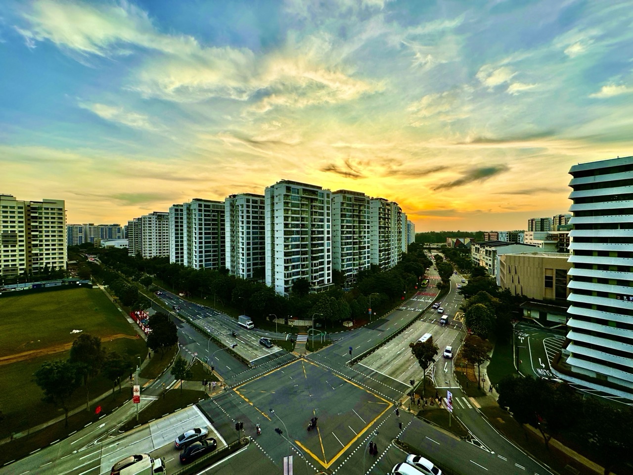 Spectacular sunset over Punggol with condominium buildings in silhouette.