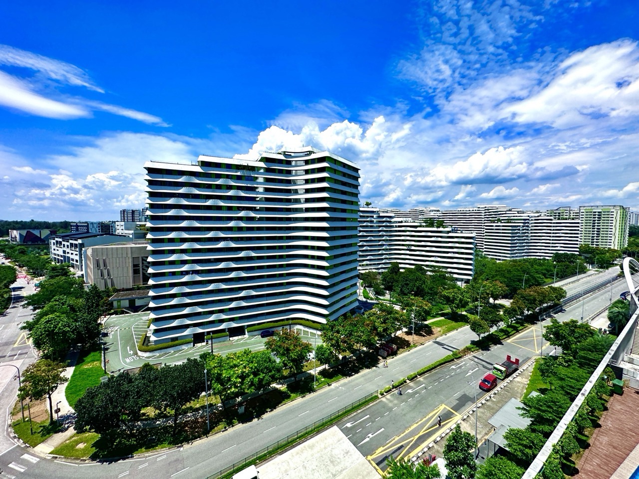 HDB flats in Punggol beneath blue skies.