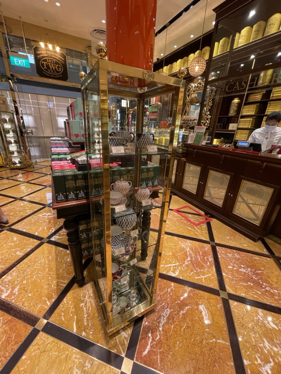 TWG Tea packs displayed with ceramic teaware.