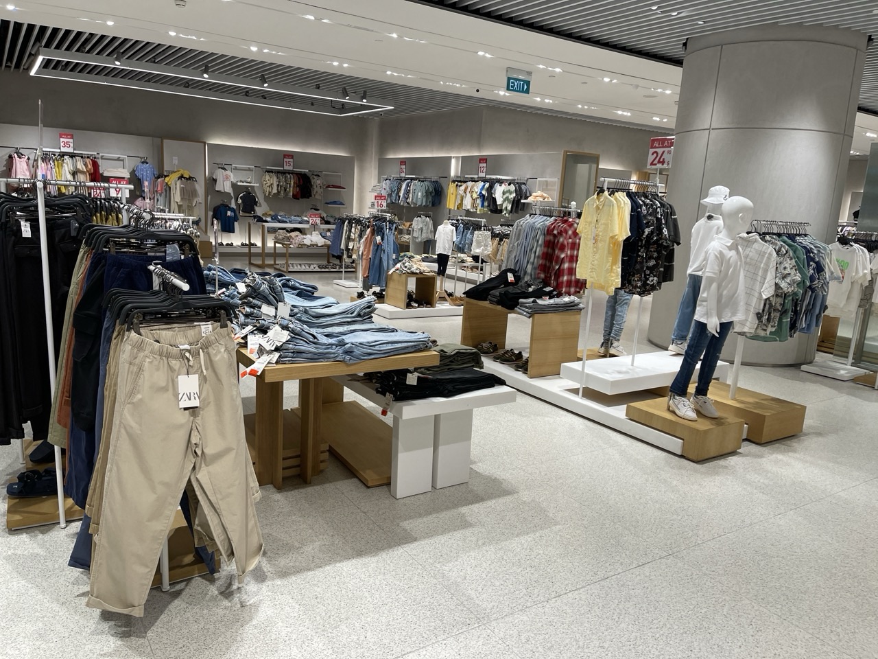 Children's clothing displayed with visible price tags.