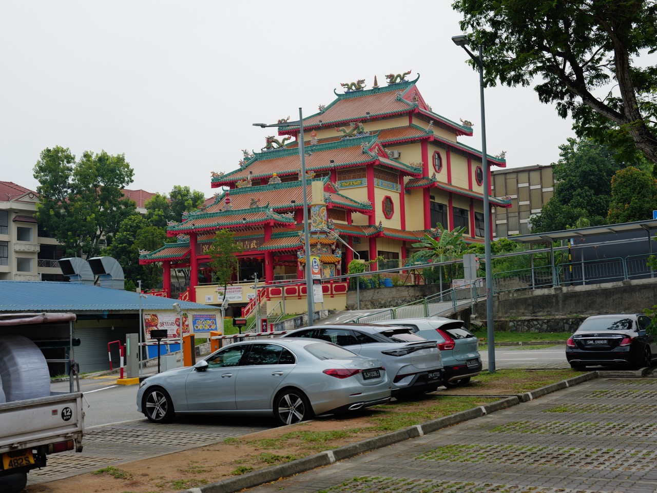 Bukit Timah Tua Pek Kong Temple with its nearby car park in Singapore.
