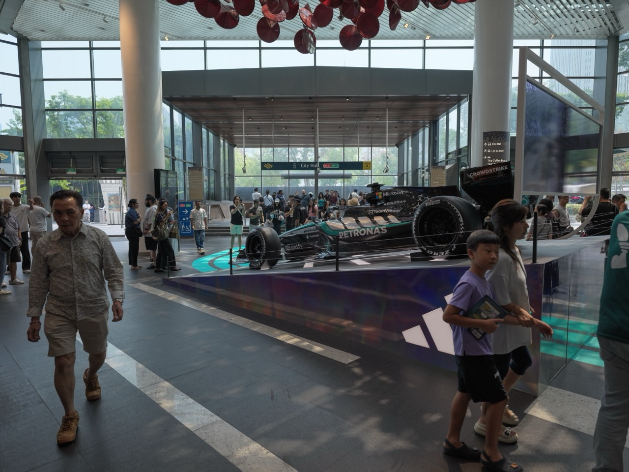 Mercedes Formula 1 car display near the MRT exit inside Raffles City Shopping Centre in Singapore