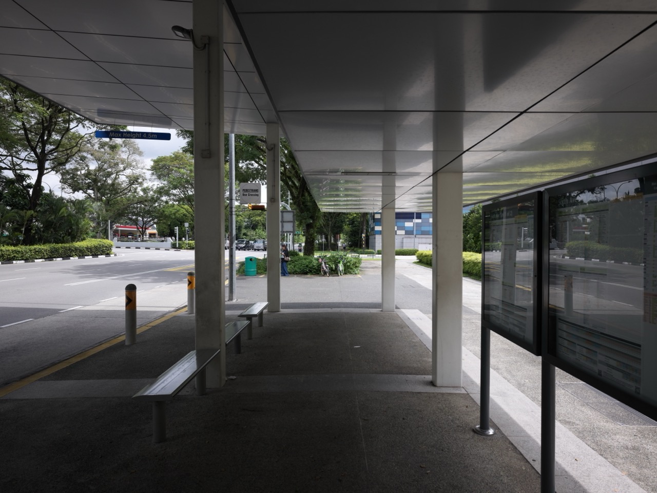 Bus stop and pick-up area beside Sixth Avenue MRT station and nearby residences in Bukit Timah