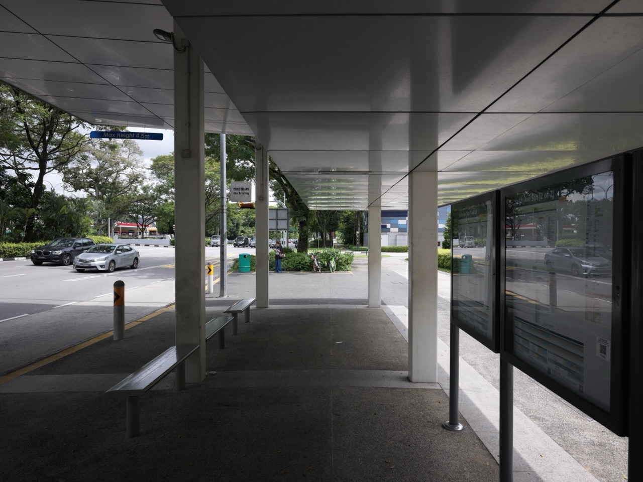 Bus stop and pick-up area beside Sixth Avenue MRT station and nearby residences in Bukit Timah