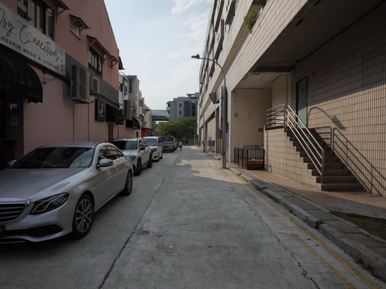 Parked cars along a back lane near Sixth Avenue in Bukit Timah, Singapore