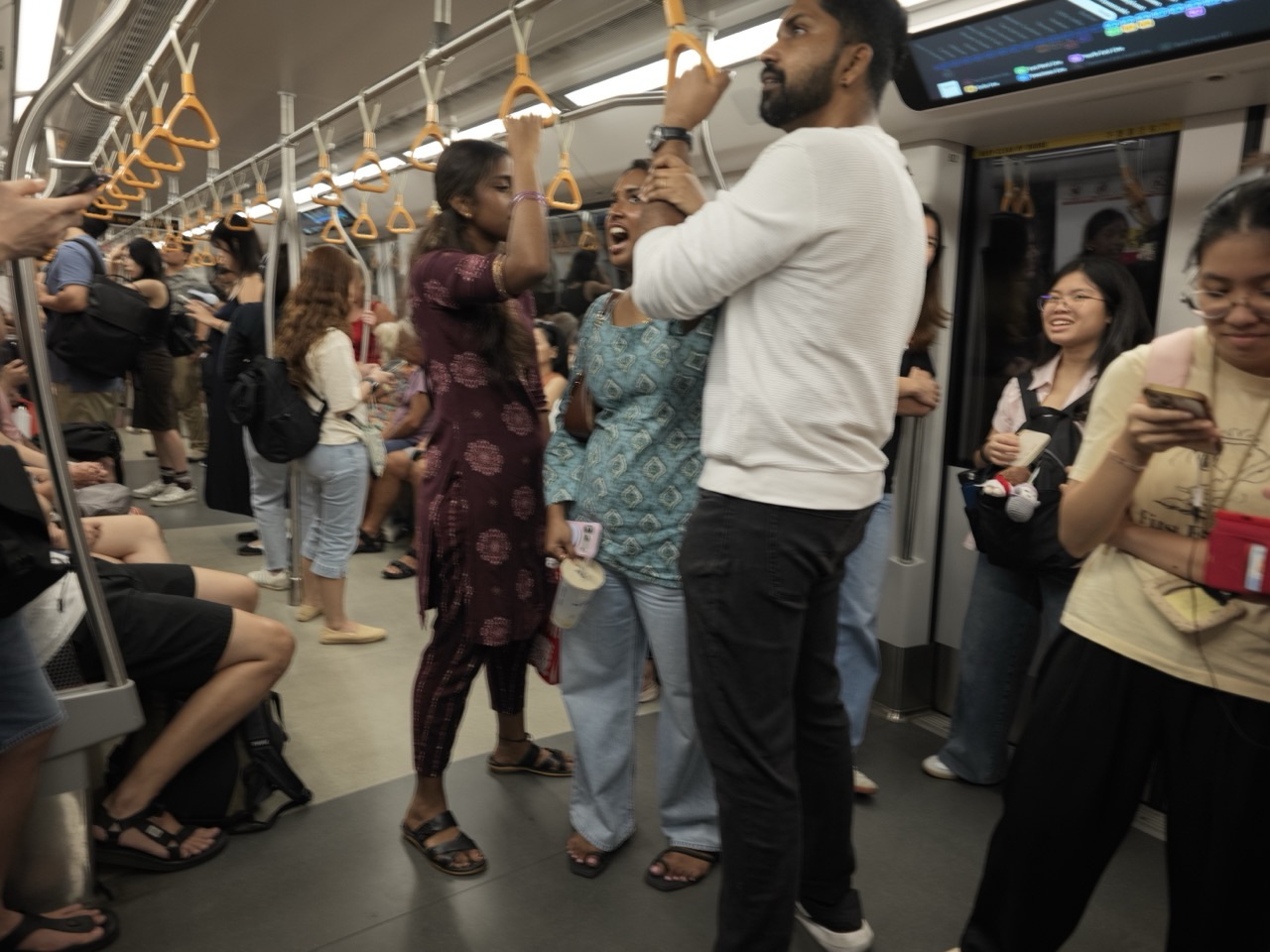 Passengers travelling inside a Singapore MRT train
