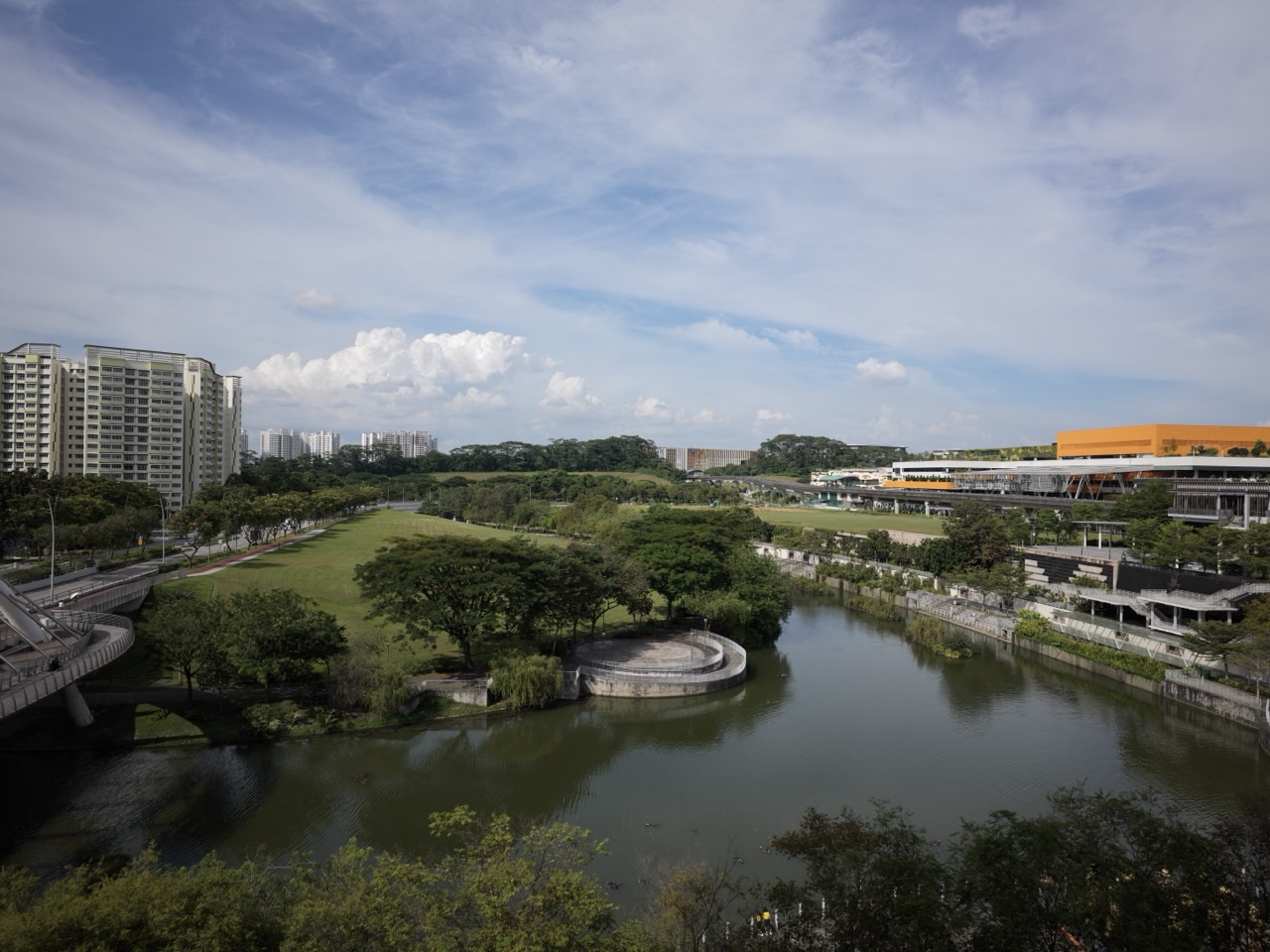 Canal and landscaped path at Punggol Waterway Park with One Punggol in view