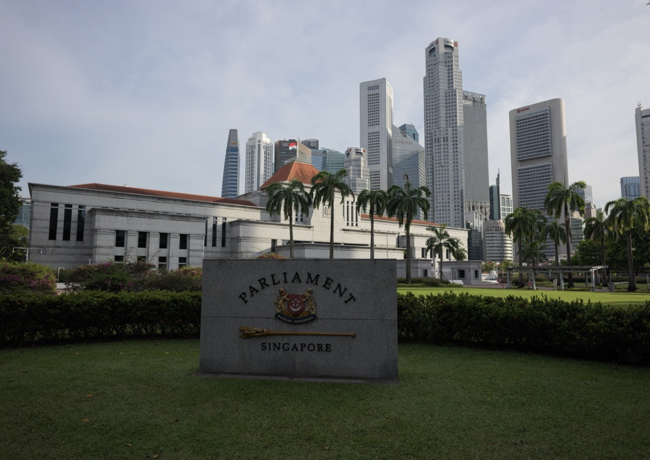 Exterior of Parliament House with Singapore's financial district skyline in the background