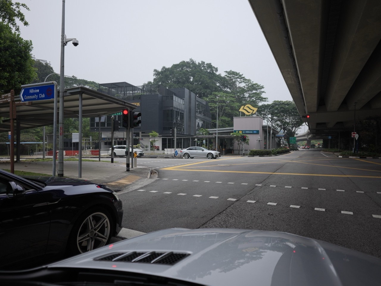 Exterior of Hillview MRT station with a pedestrian crossing in Singapore.