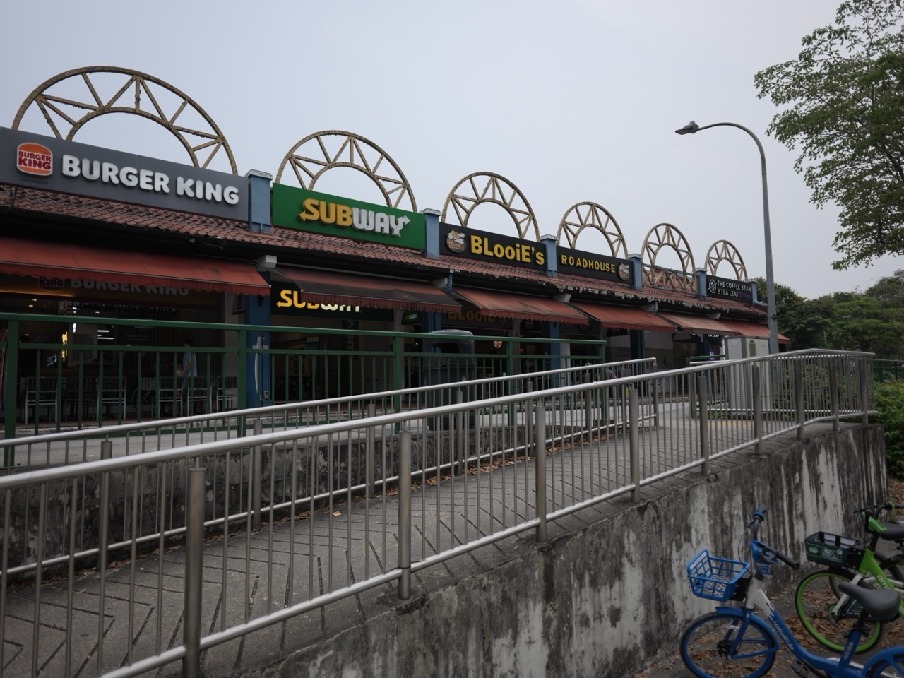 Shops and restaurants along The Rail Mall on Upper Bukit Timah Road in Singapore.