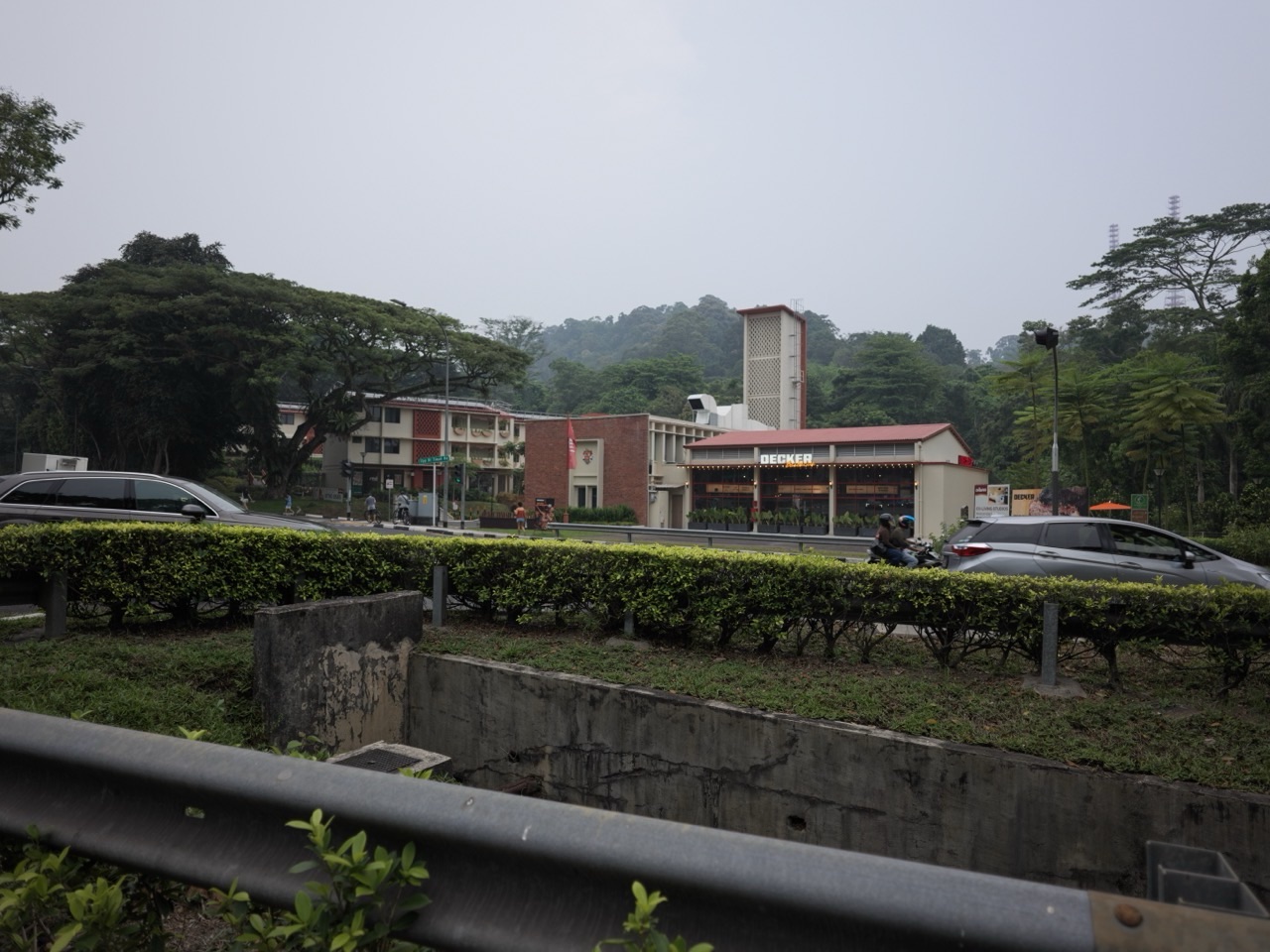 Former Bukit Timah Fire Station exterior with restaurant and dining activity in Singapore.