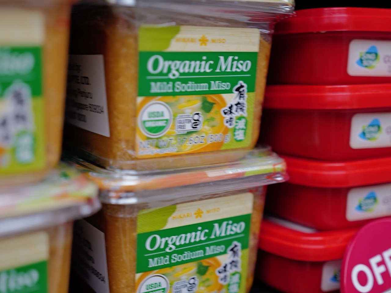 Miso paste displayed on a supermarket shelf.