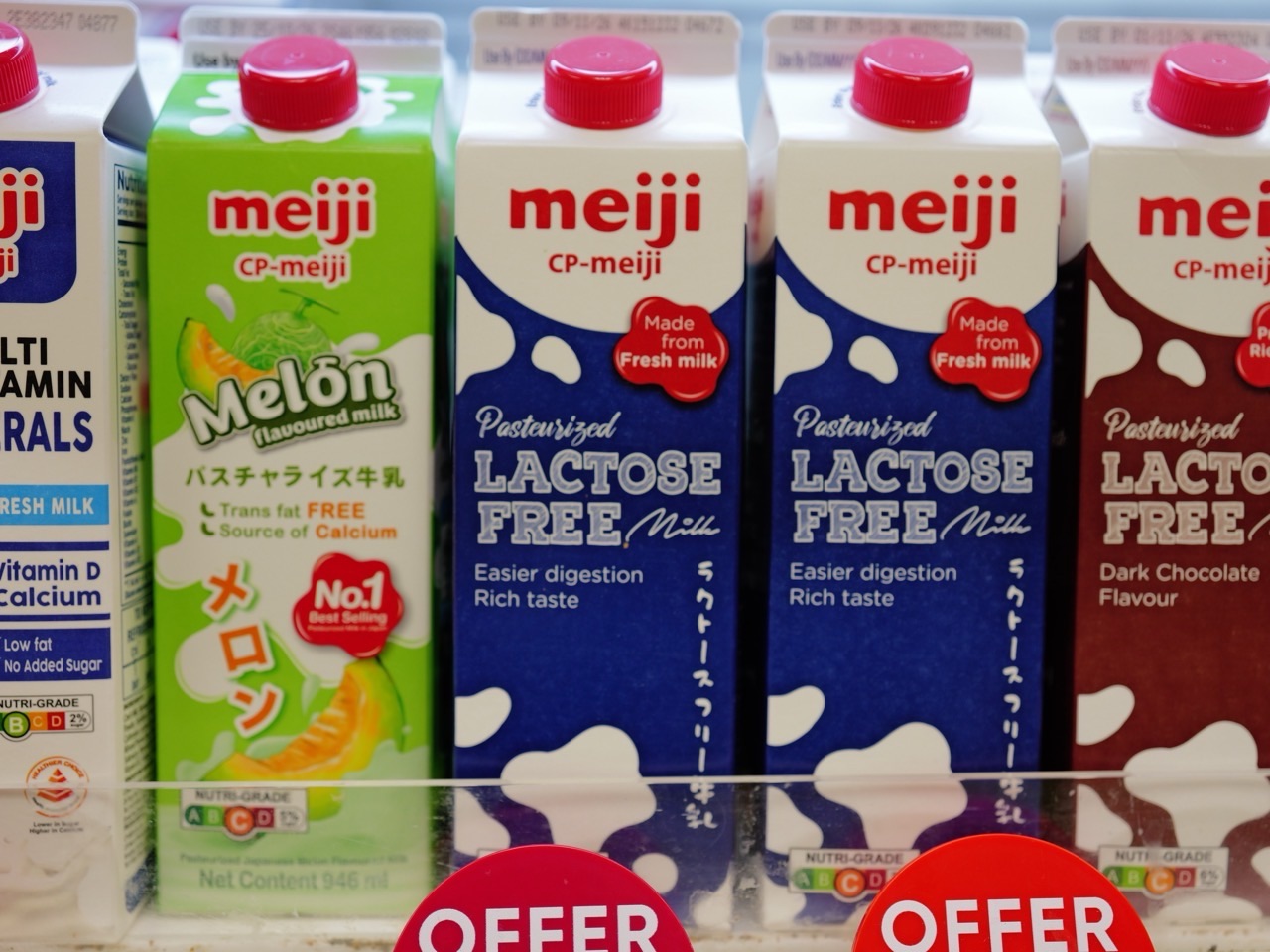 Milk packaged in Tetra Pak cartons on a supermarket shelf.