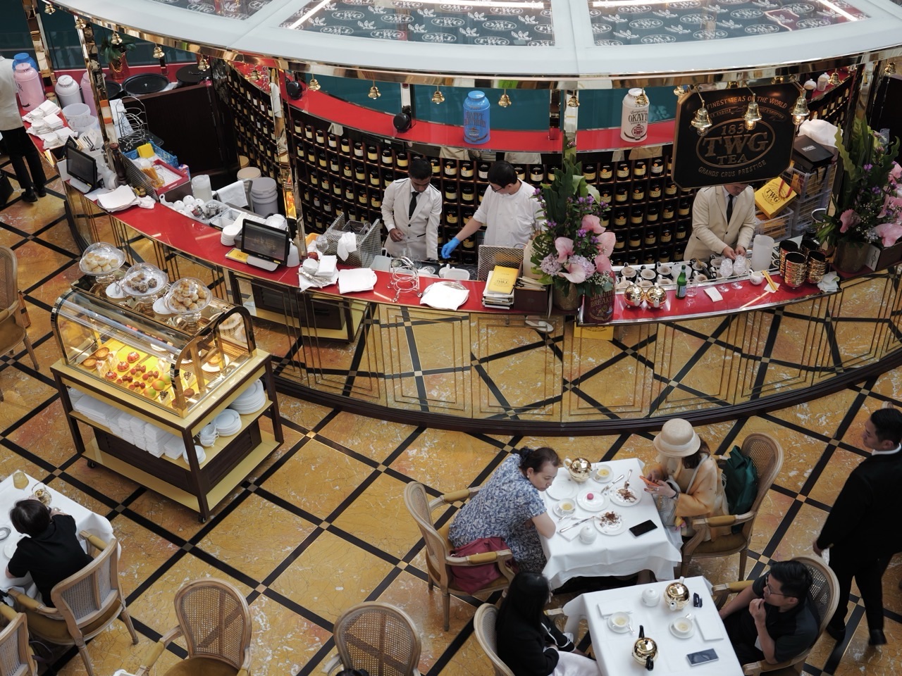 Staff working at a restaurant serving counter during tea time at Marina Bay Sands.