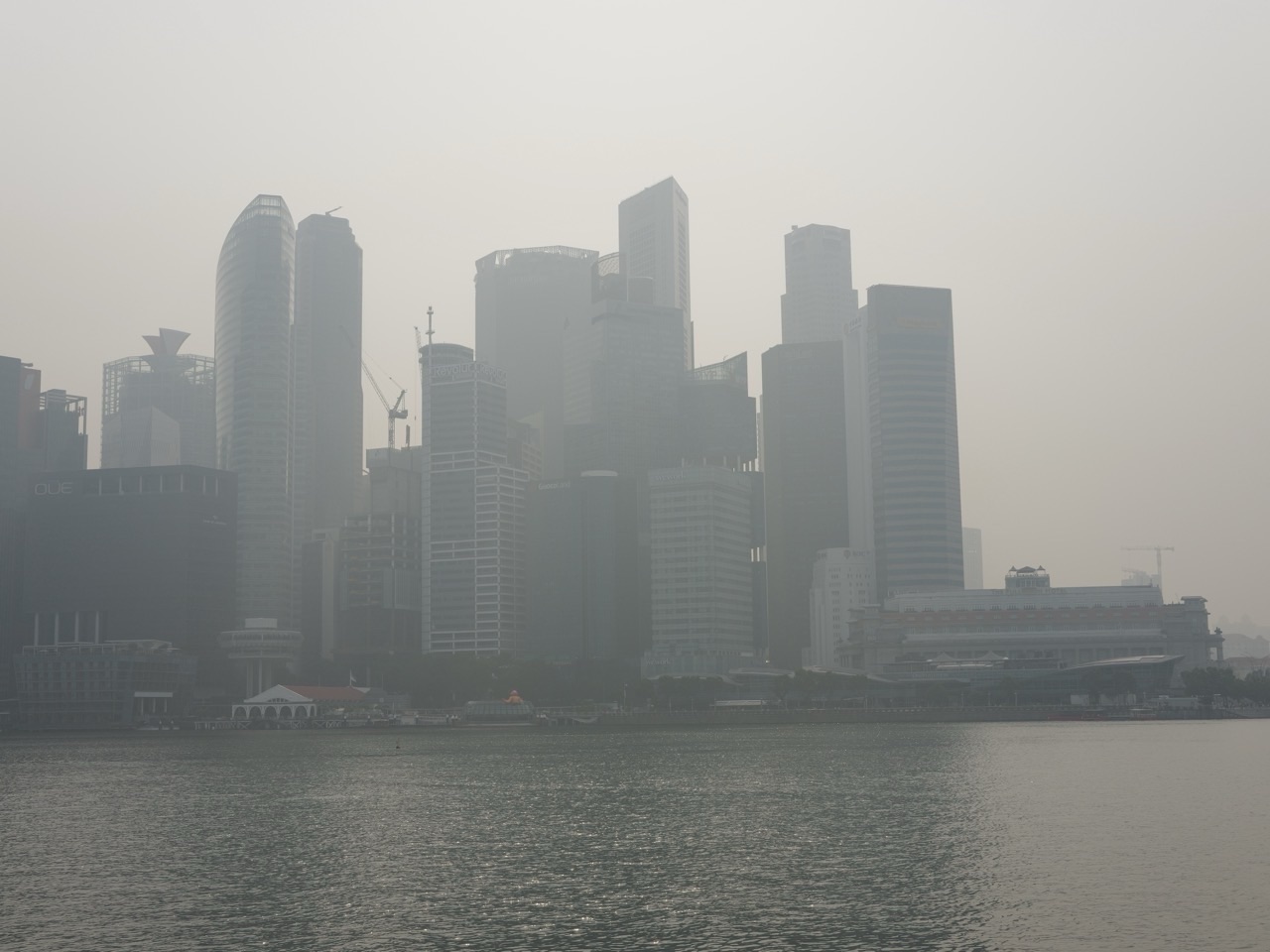 Singapore skyline softened by haze in a view from Marina Bay Sands.