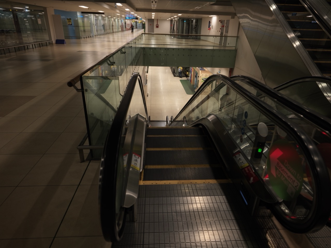 Escalator and office area inside Singapore Changi Airport Terminal 2.