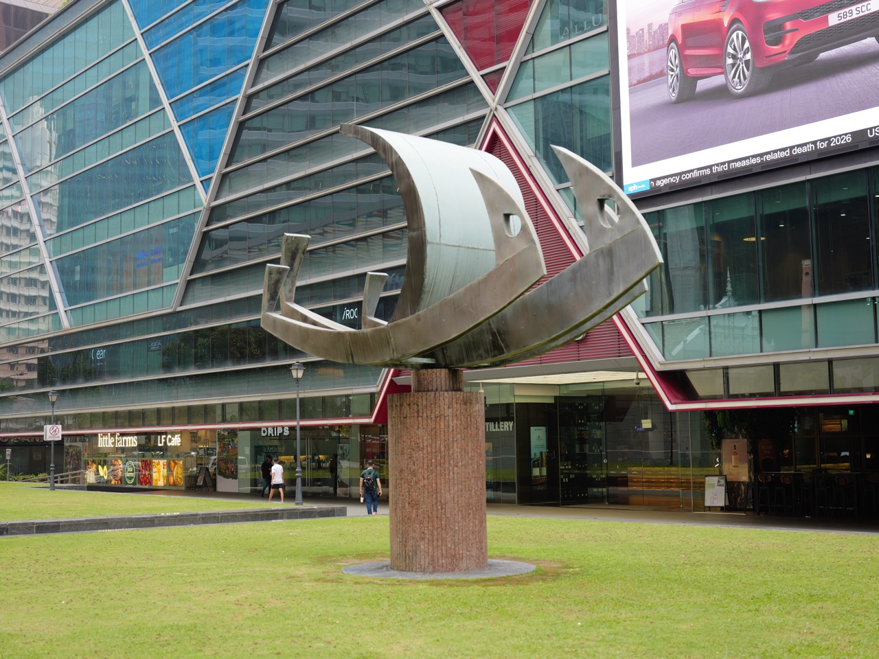 Outdoor art installation and sculpture in a park near Singapore's financial district.