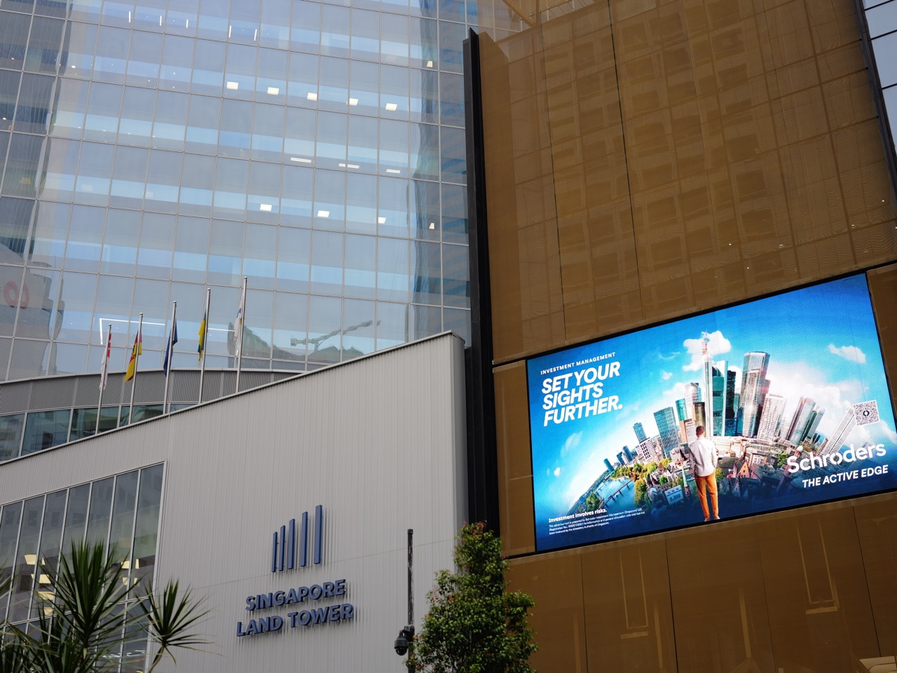 Exterior facade of Singapore Land Tower in the Raffles Place financial district.