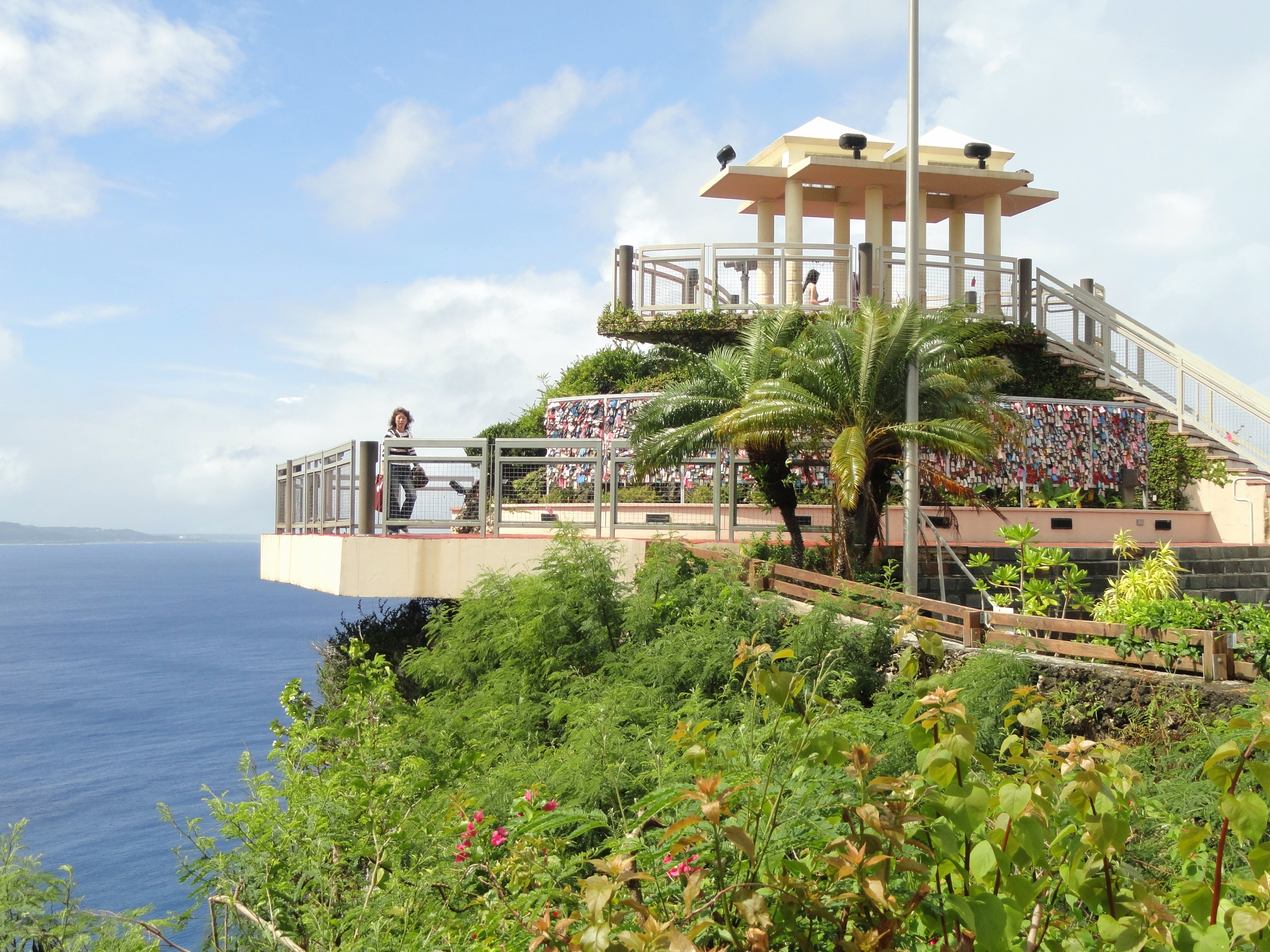 Photograph from 2011 of the Two Lovers Point viewing platform overlooking the Pacific Ocean in Guam; not a depiction of post-typhoon conditions.