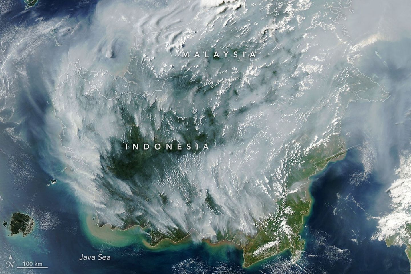 NASA Aqua satellite image of smoke from peatland fires in Indonesian Borneo with northern Malaysia visible