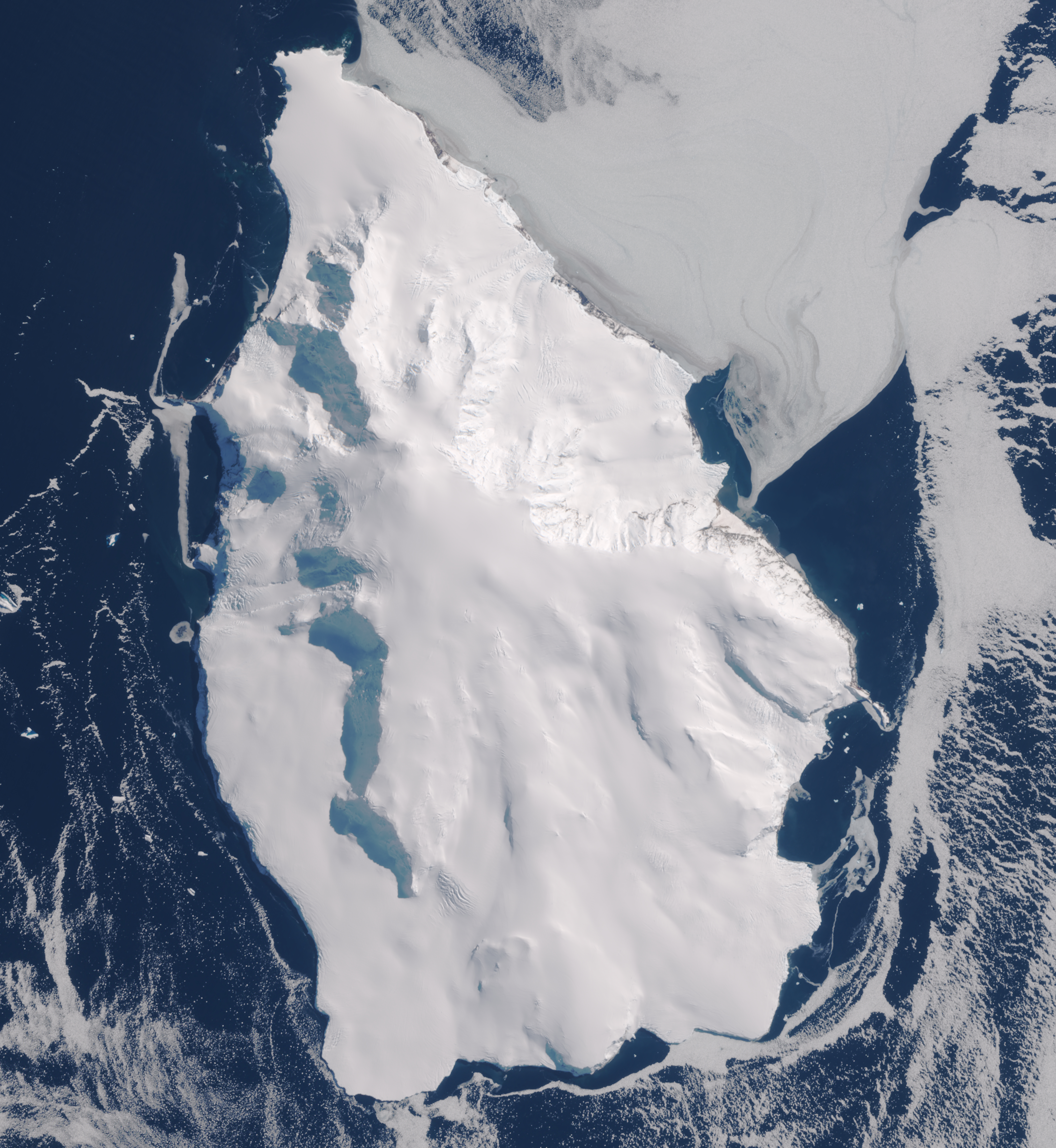Natural-colour satellite image of Peter I Island's snow and ice cap surrounded by dark ocean