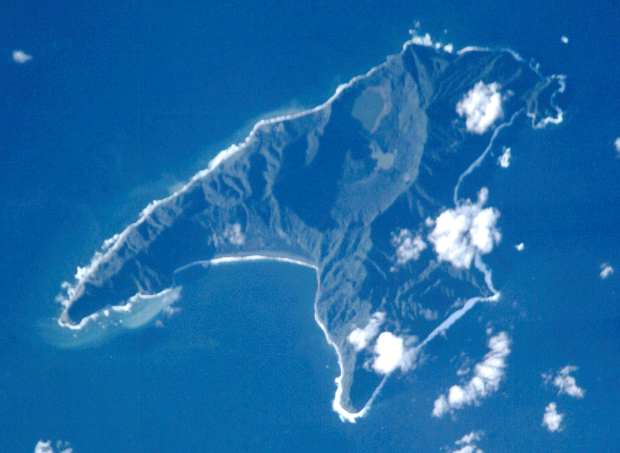 Astronaut satellite view of Raoul Island in the Kermadec Islands with the volcanic terrain, bays and ocean visible from above