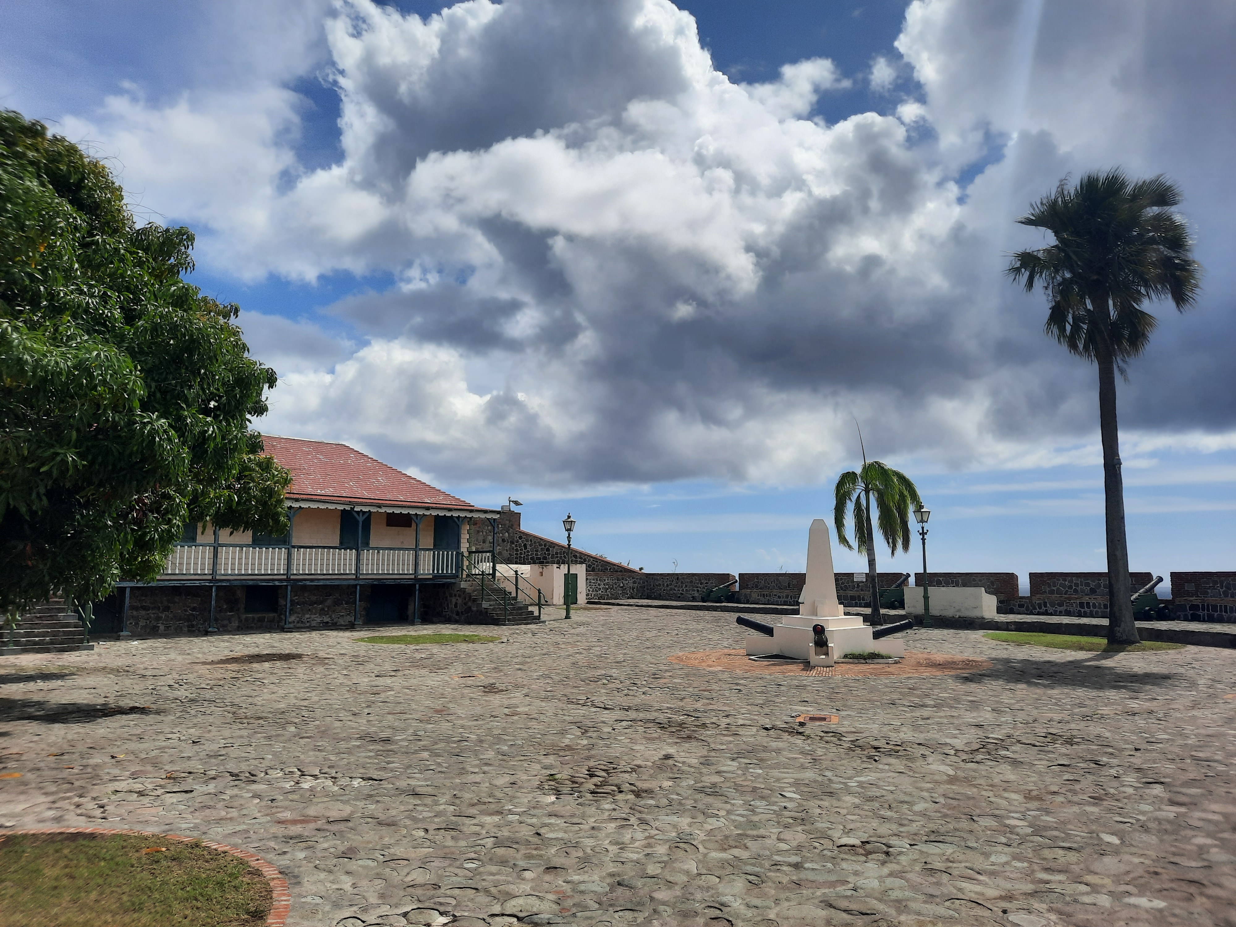 Sunny open courtyard and ramparts of Fort Oranje in Oranjestad, Sint Eustatius, photographed in 2025.