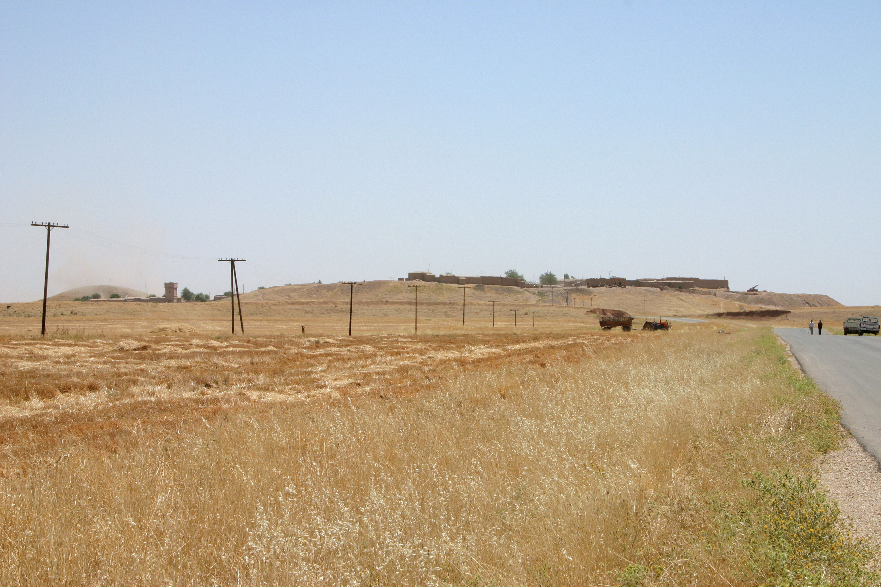 Archaeological earthworks and excavated ruins of Tell Leilan in northeastern Syria, an urban centre associated with the Akkadian-period Khabur region.
