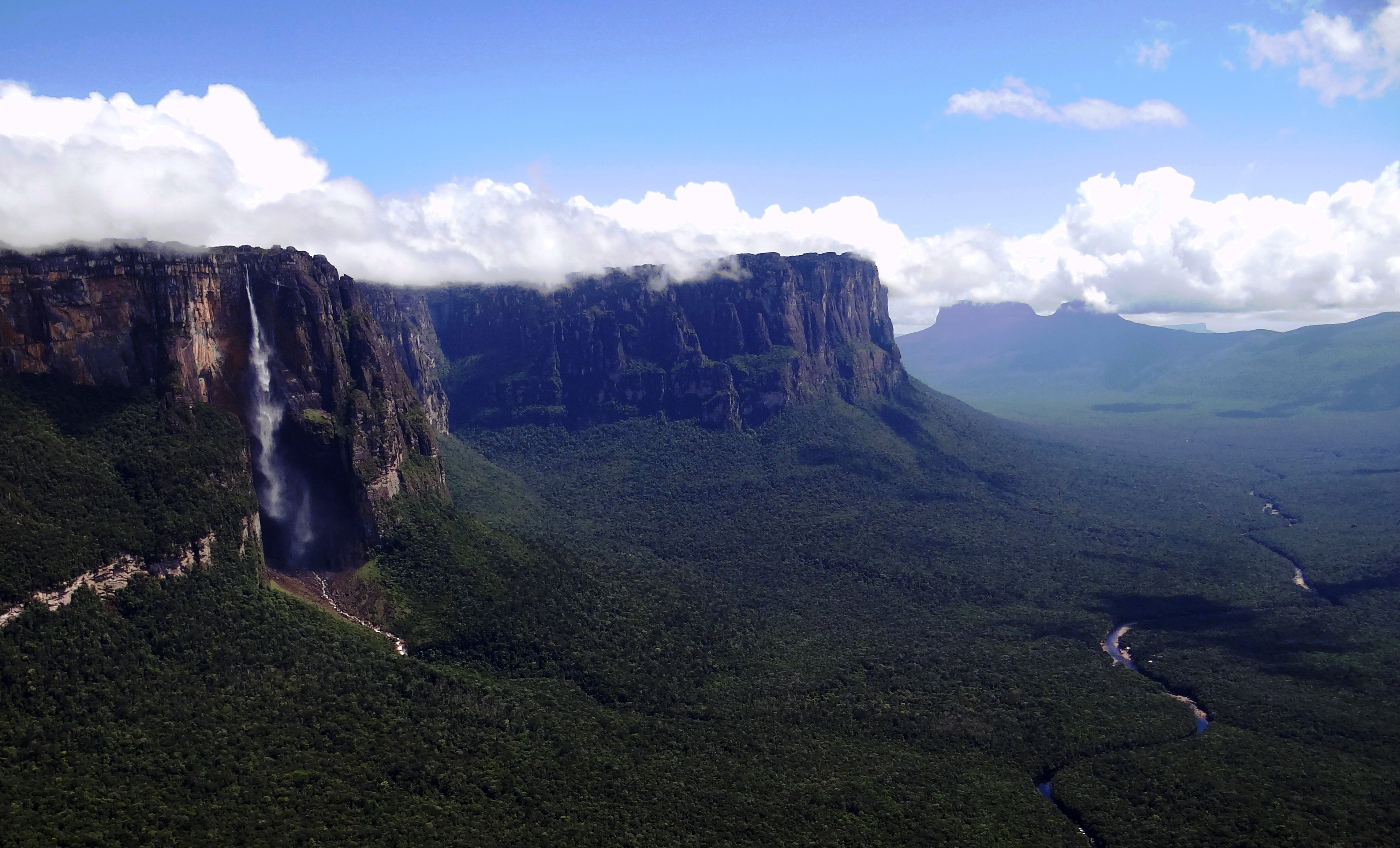 Panoramic 2013 photograph of Angel Falls descending from the tepui cliffs above the forested Cañón del Diablo in Venezuela's Canaima National Park.